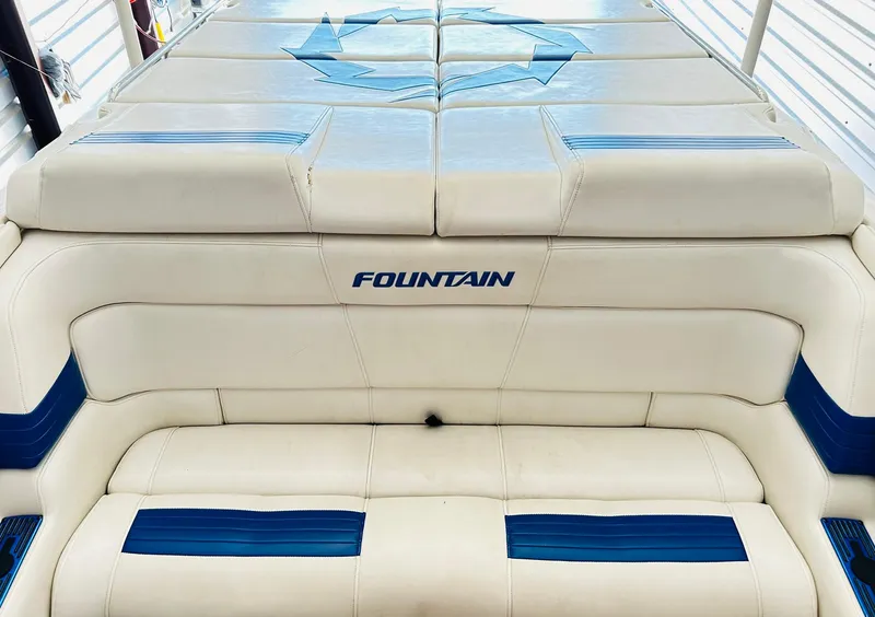 Slide: The Image of 2005 Fountain 42 Executioner boat interior with white and blue seating. - 35