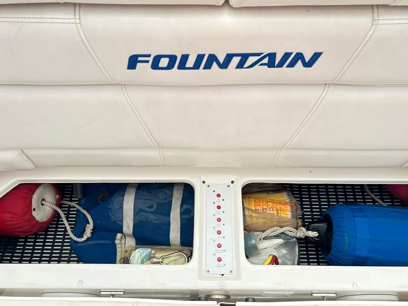 Slide: The Image of Storage compartment of a 2005 Fountain 42 Executioner boat with safety equipment. - 37