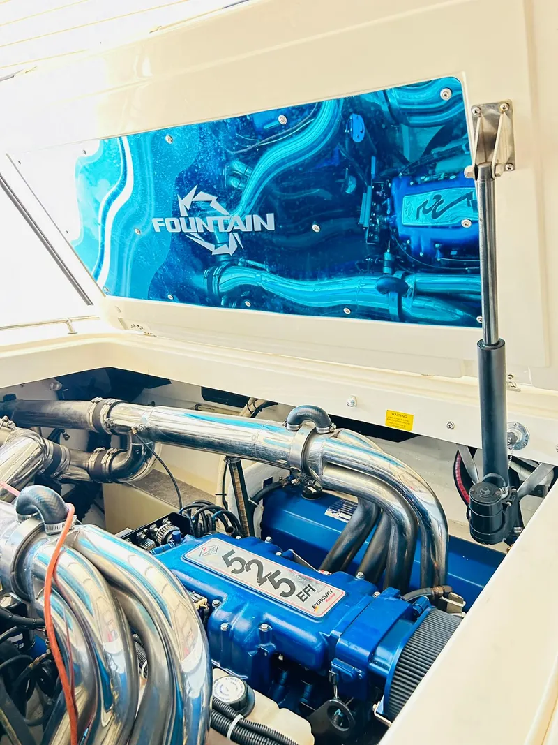 Slide: The Image of 2005 Fountain 42 Executioner engine compartment with polished components and blue accents. - 40