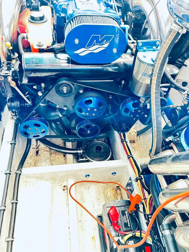 Slide: The Image of Engine compartment of a 2005 Fountain 42 Executioner boat, showcasing mechanical components. - 42