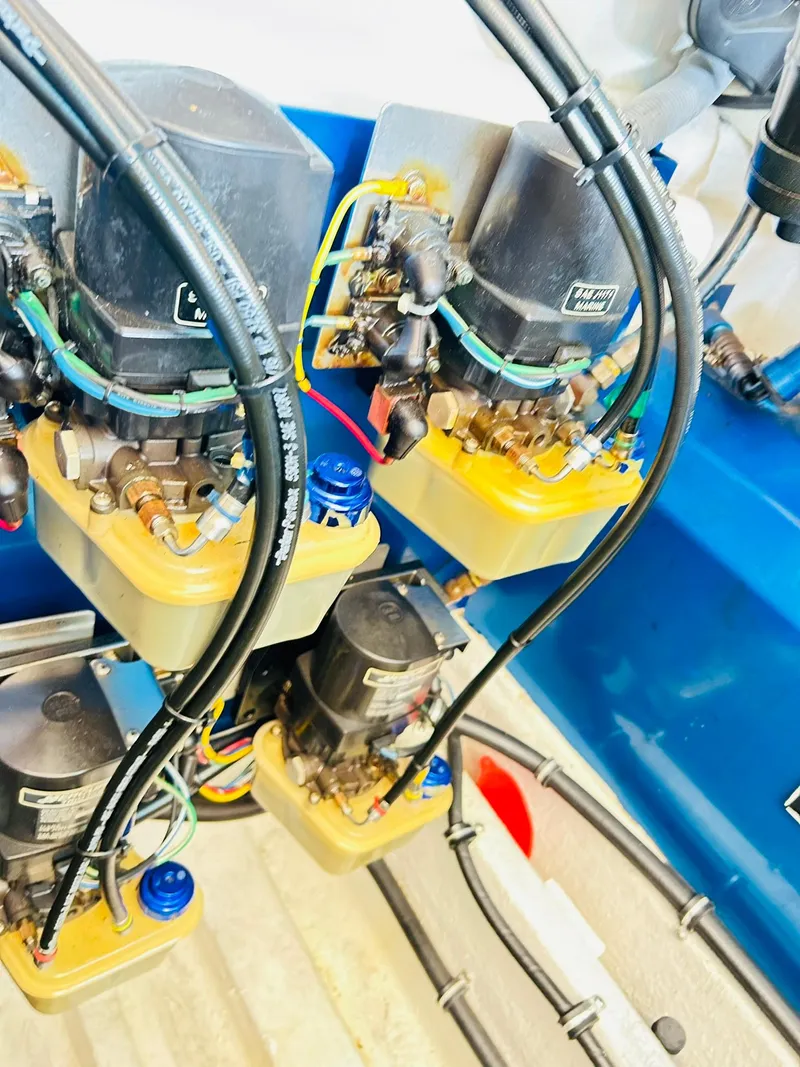 Slide: The Image of Close-up of 2005 Fountain 42 Executioner engine components with wiring and hydraulic systems. - 43