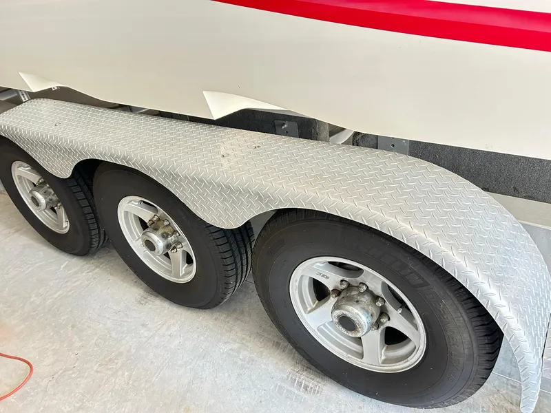 Slide: The Image of Triple-axle trailer with diamond plate fenders for 2005 Fountain 42 Executioner boat. - 49