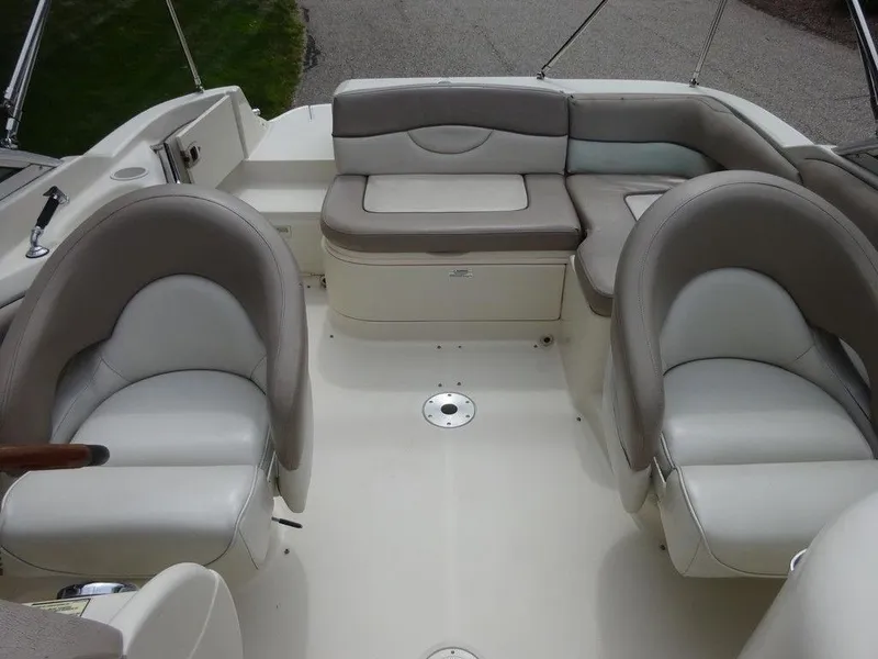 Slide: The Image of 2004 Sea Ray 220 Sundeck interior with plush seating and spacious layout. - 19