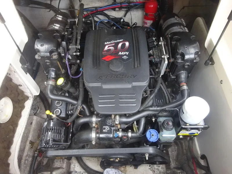 Slide: The Image of 2004 Sea Ray 220 Sundeck engine compartment with MerCruiser 5.0 MPI engine. - 20