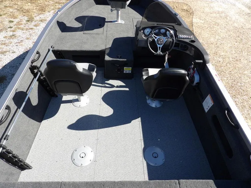 Slide: The Image of 2025 Crestliner 1750 Fish Hawk SC interior with dual seats and steering console. - 19
