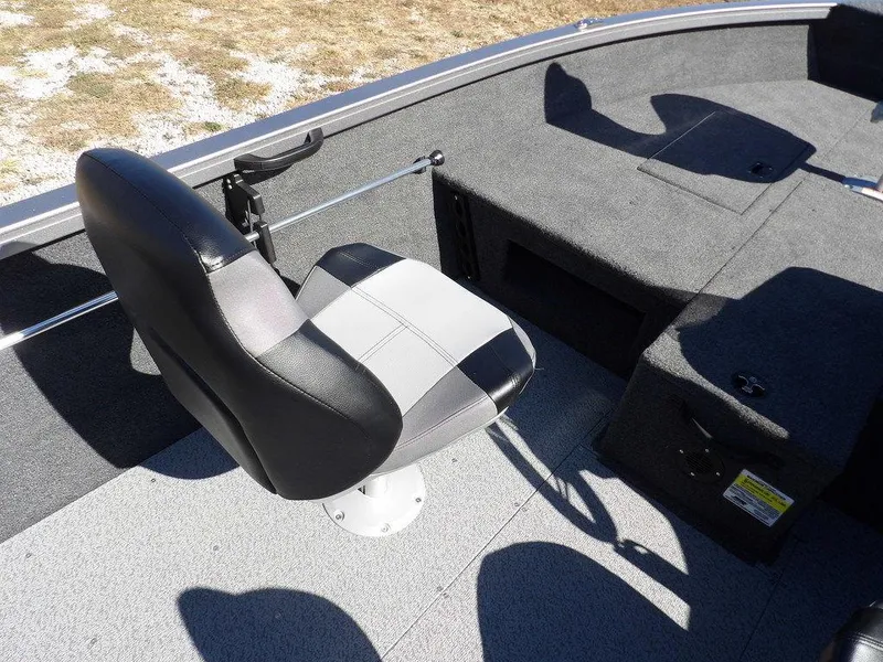 Slide: The Image of 2025 Crestliner 1750 Fish Hawk SC dashboard with power outlets and storage compartment. - 27