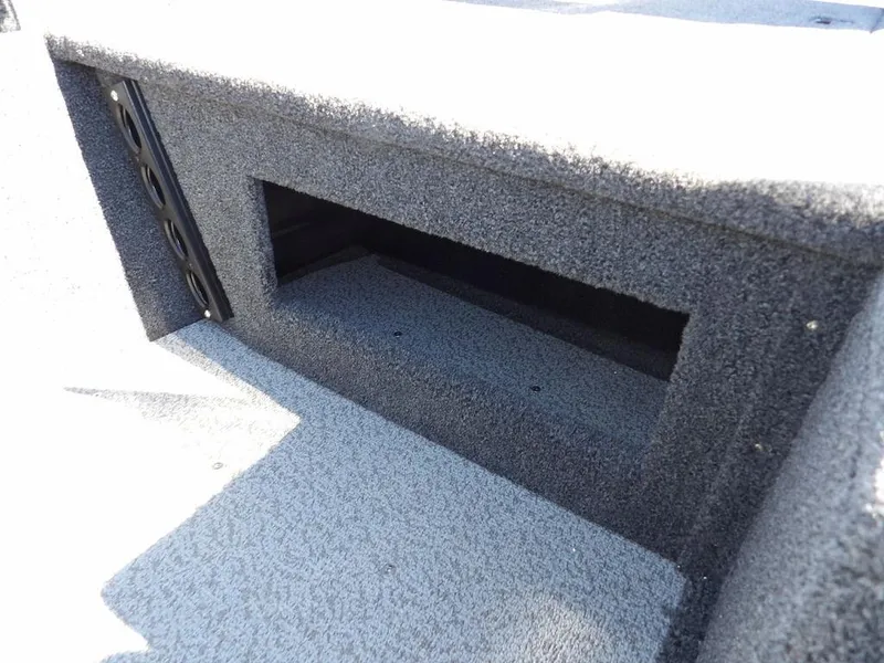 Slide: The Image of 2025 Crestliner 1750 Fish Hawk SC interior storage compartment, carpeted finish. - 28