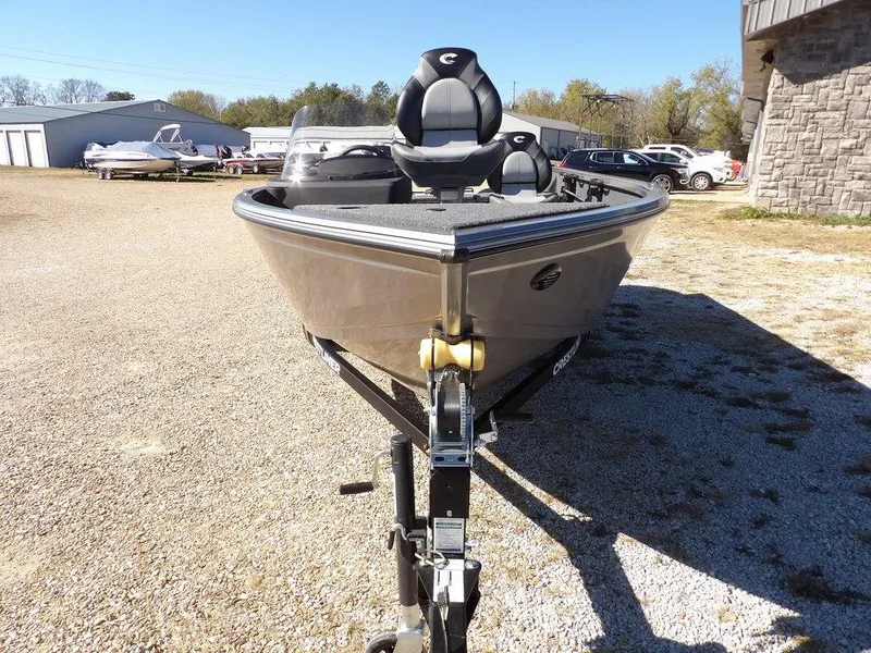 Slide: The Image of 2025 Crestliner 1750 Fish Hawk SC boat, rear view, red exterior, outboard motor. - 3