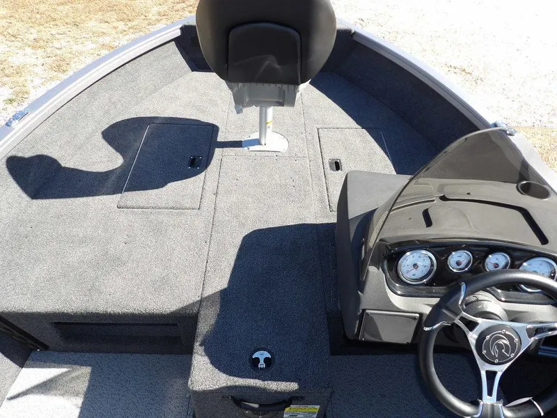 Slide: The Image of 2025 Crestliner 1750 Fish Hawk SC interior with dual seats and steering console. - 30