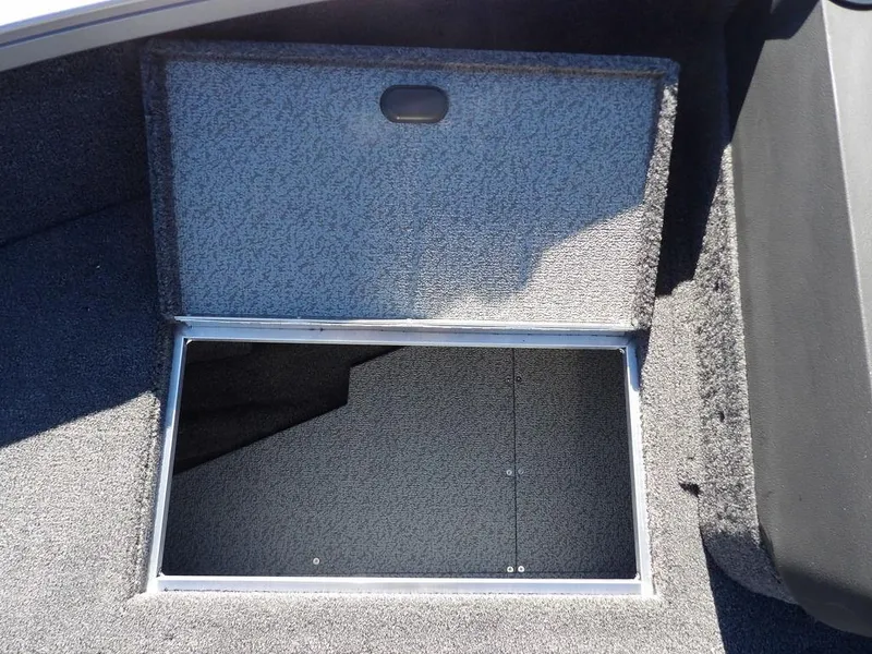 Slide: The Image of 2025 Crestliner 1750 Fish Hawk SC boat interior with carpeted storage area. - 34