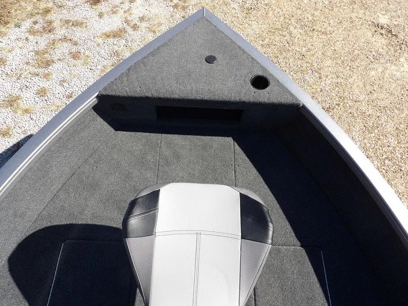 Slide: The Image of 2025 Crestliner 1750 Fish Hawk SC storage compartment with open hatch and hydraulic support. - 35