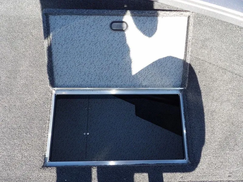 Slide: The Image of 2025 Crestliner 1750 Fish Hawk SC boat interior with gray carpet and seating. - 36