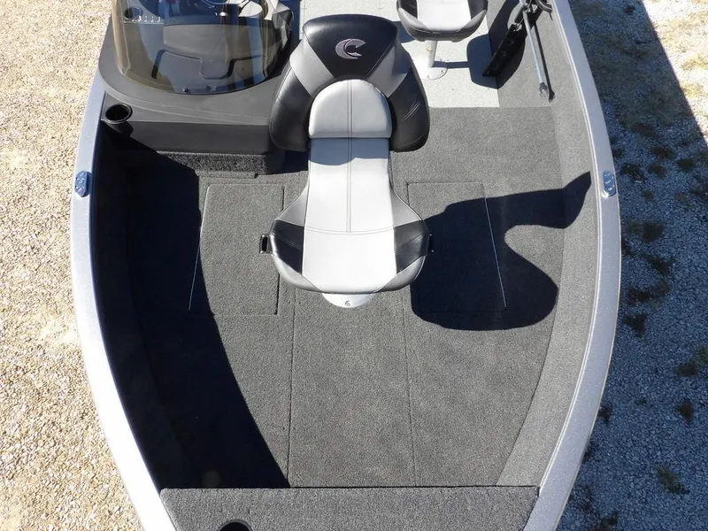 Slide: The Image of 2025 Crestliner 1750 Fish Hawk SC boat on trailer, red hull, parked on gravel. - 38