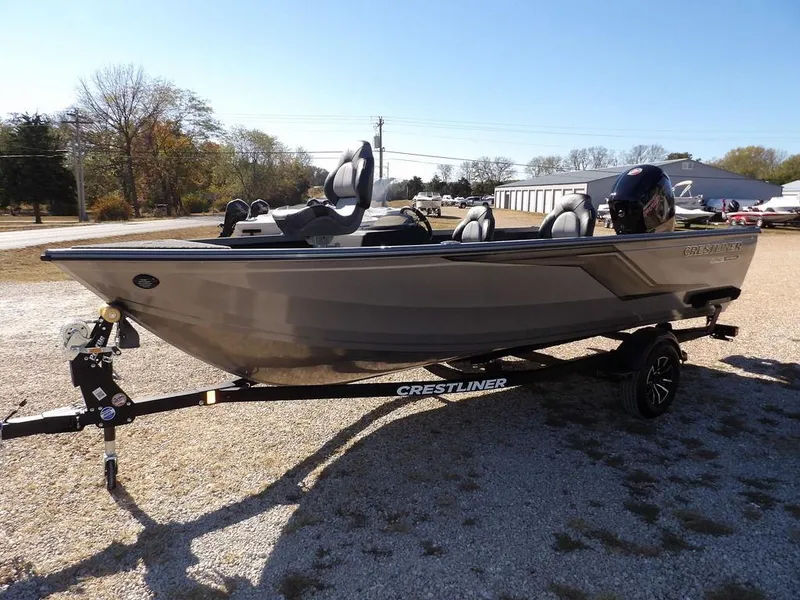 Slide: The Image of 2025 Crestliner 1750 Fish Hawk SC in vibrant red on trailer, parked outdoors. - 4