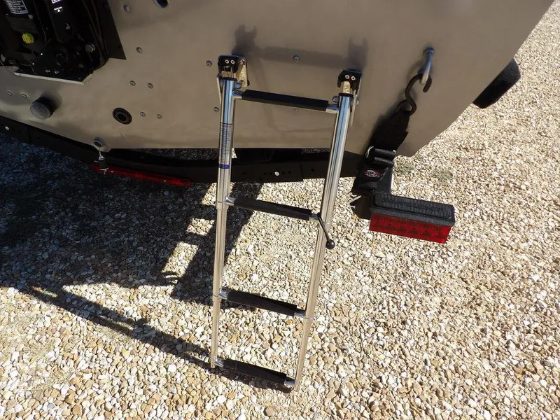 Slide: The Image of 2025 Crestliner 1750 Fish Hawk SC in vibrant red, displayed on a trailer. - 45