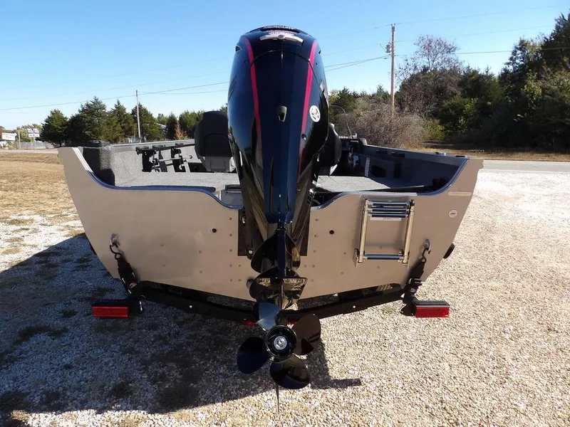 Slide: The Image of 2025 Crestliner 1750 Fish Hawk SC in vibrant red, parked outdoors on gravel. - 7