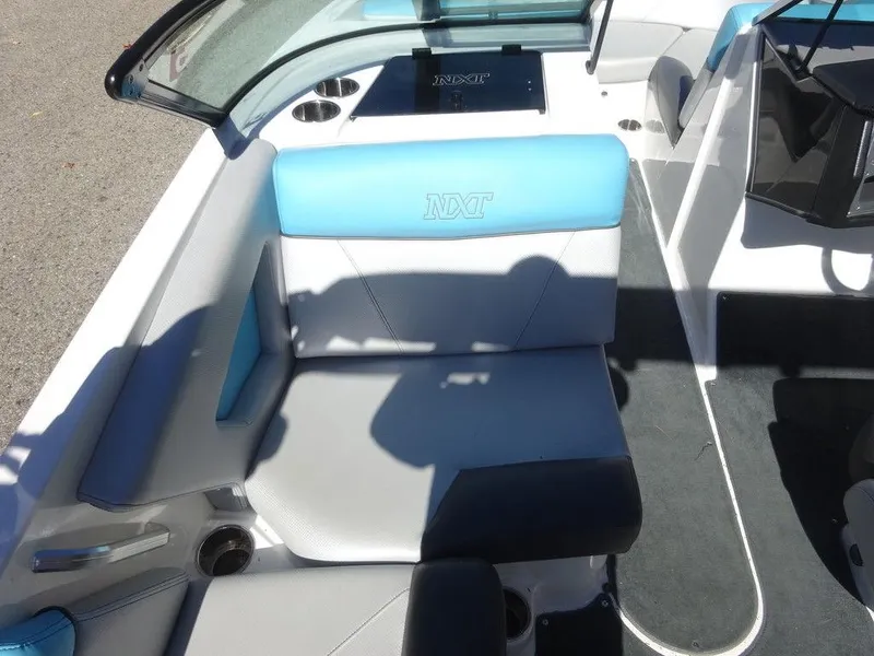 Slide: The Image of 2019 MasterCraft NXT20 boat interior with blue and gray seating. - 12
