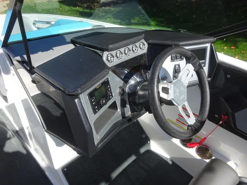 Slide: The Image of 2019 MasterCraft NXT20 boat dashboard with steering wheel and control panel. - 14