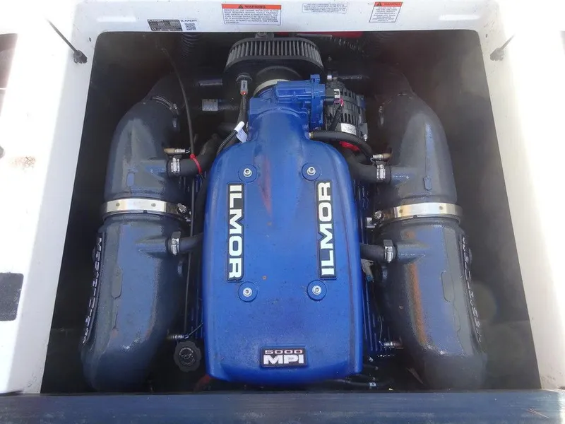 Slide: The Image of 2019 MasterCraft NXT20 Ilmor engine, blue with dual exhaust manifolds. - 16