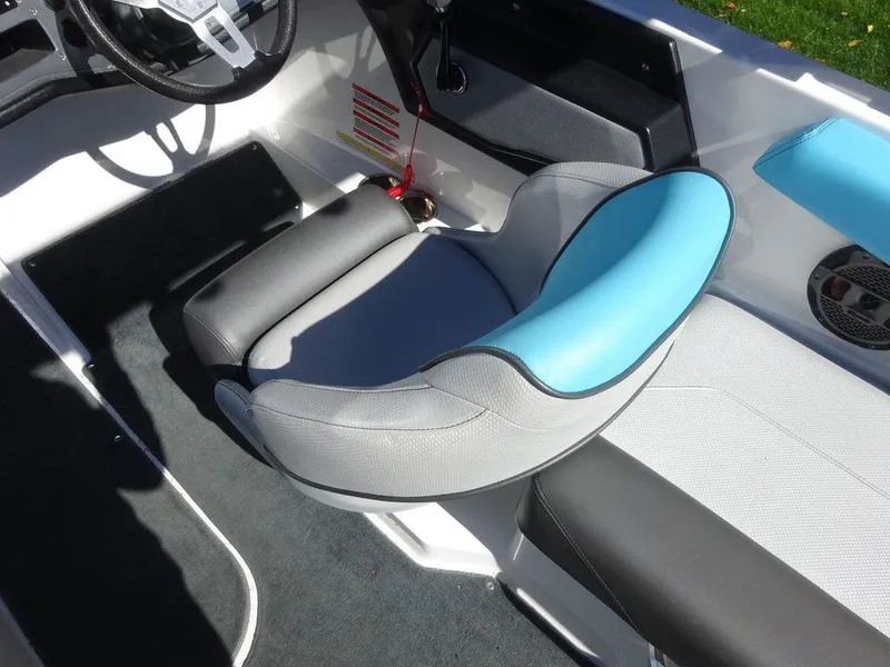 Slide: The Image of 2019 MasterCraft NXT20 boat interior with blue and gray seating. - 8