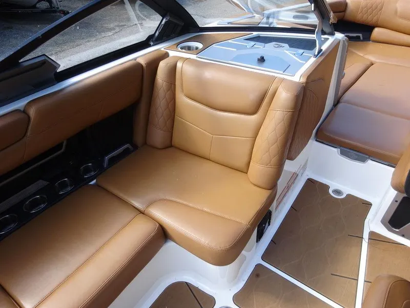 Slide: The Image of 2020 Malibu M240 boat interior with luxurious brown leather seating and modern design. - 14