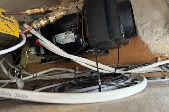 Slide: The Image of Electrical setup on a 1979 CAL 39 MK II Tall Rig sailboat, featuring a Netgear switch. - 45
