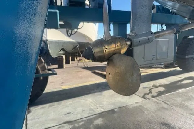 Slide: The Image of 1979 CAL 39 MK II Tall Rig sailboat being lifted at a marina. - 58