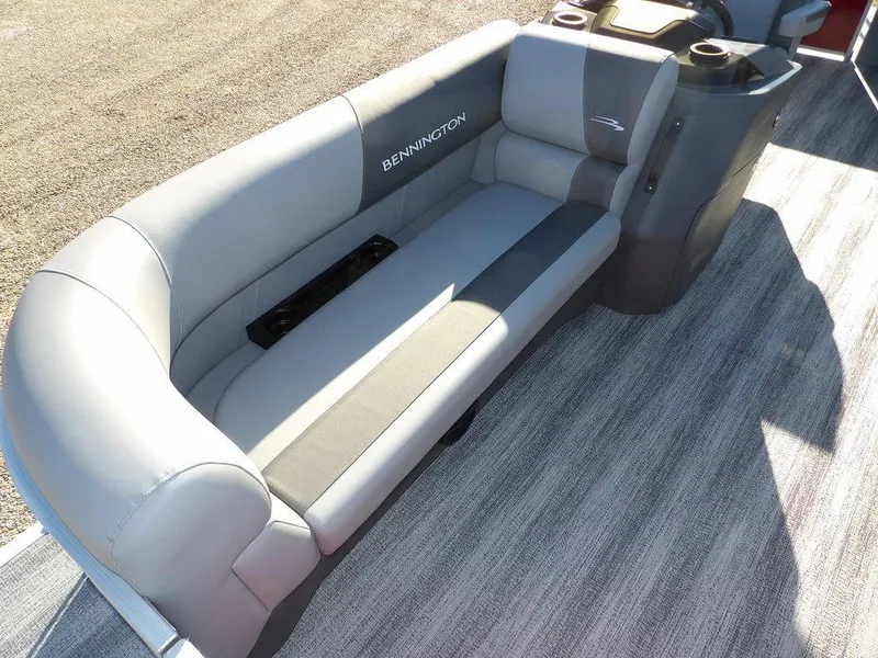Slide: The Image of 2025 Bennington 21 SLJ boat interior with gray seating and cup holders. - 10