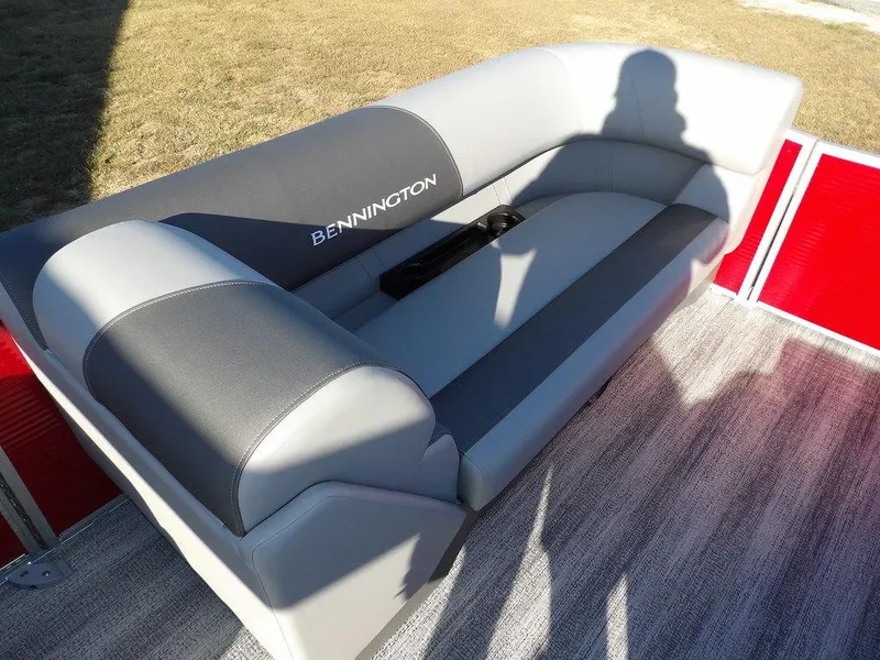 Slide: The Image of 2025 Bennington 21 SLJ boat seat with gray upholstery and cup holders. - 13