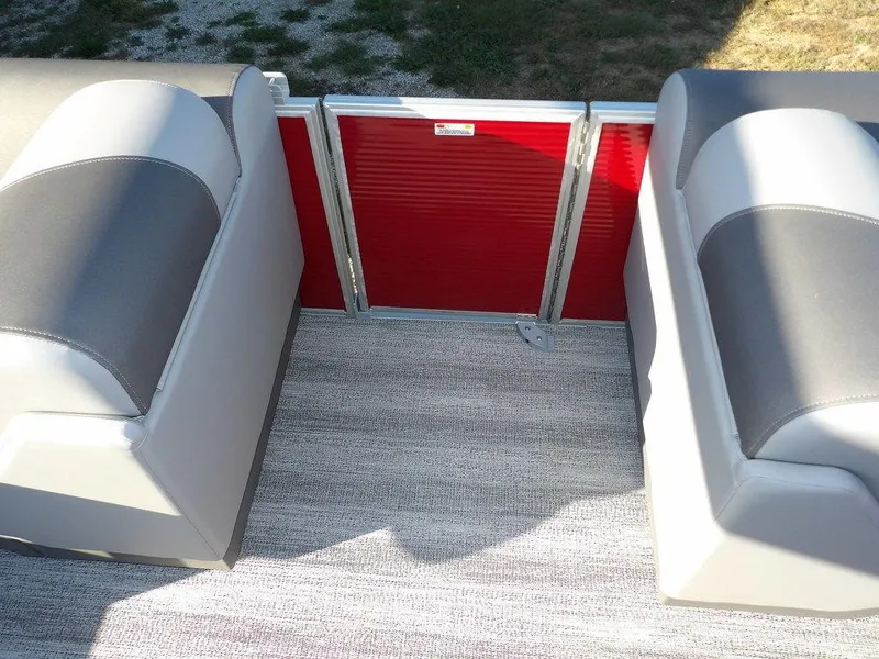 Slide: The Image of 2025 Bennington 21 SLJ boat interior with gray seating and red panel. - 14