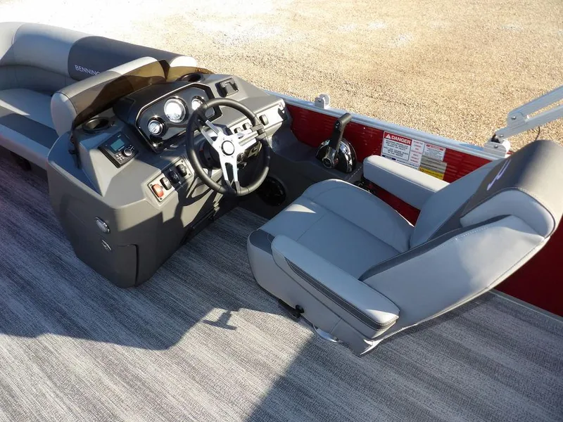 Slide: The Image of 2025 Bennington 21 SLJ boat interior with modern steering console and comfortable seating. - 18