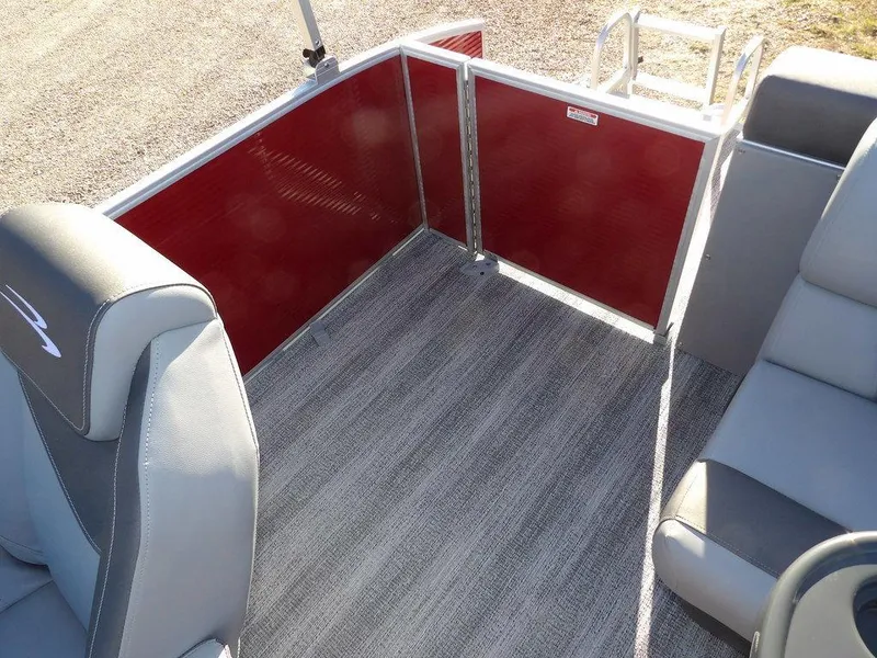 Slide: The Image of 2025 Bennington 21 SLJ boat interior with gray seating and red paneling. - 22