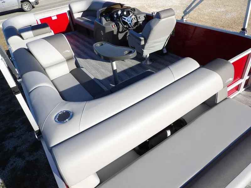 Slide: The Image of 2025 Bennington 21 SLJ pontoon boat interior with gray seating and steering console. - 25