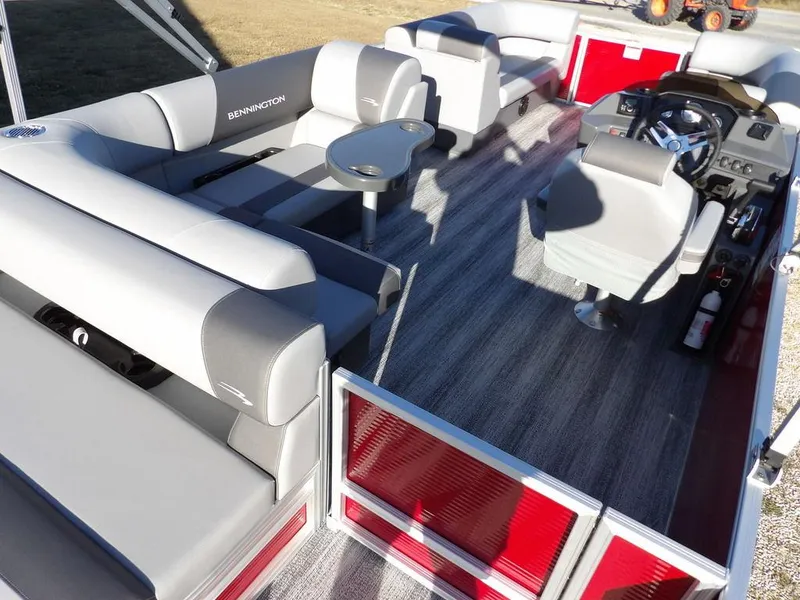 Slide: The Image of 2025 Bennington 21 SLJ pontoon boat interior with modern seating and steering console. - 26