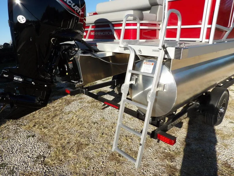 Slide: The Image of 2025 Bennington 21 SLJ pontoon boat with ladder and Mercury outboard motor. - 36