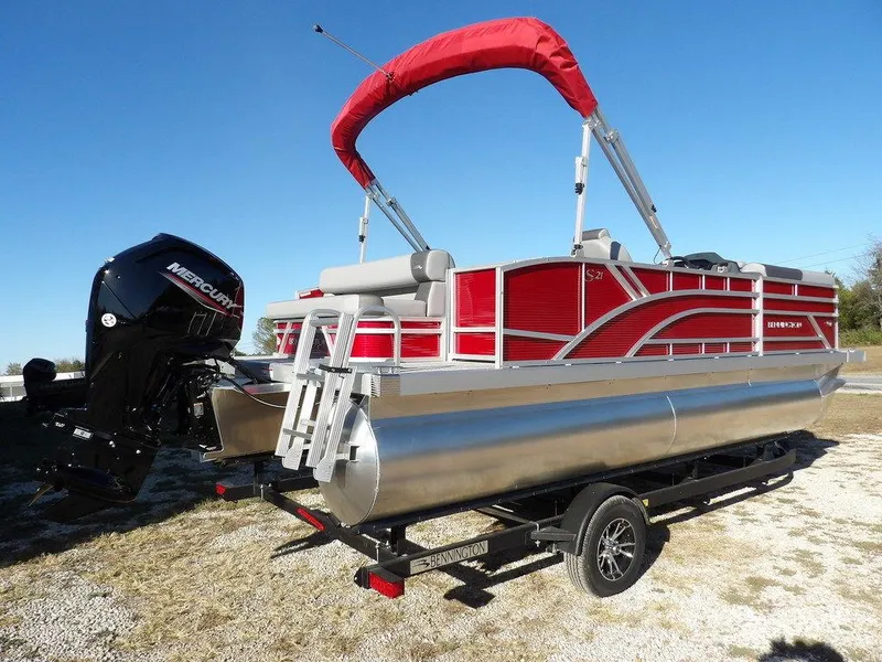 Slide: The Image of 2025 Bennington 21 SLJ pontoon boat with red canopy and Mercury outboard motor. - 6