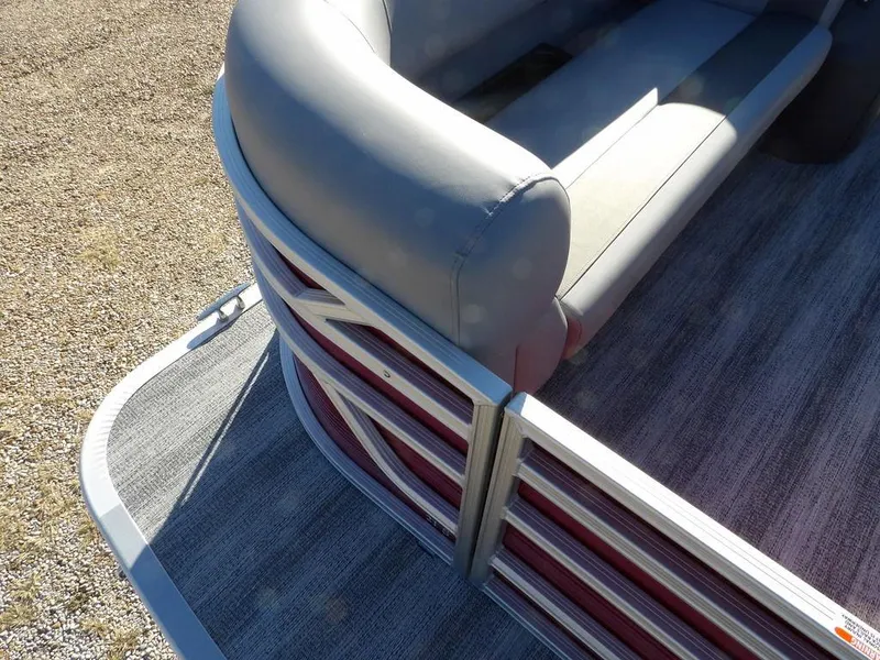 Slide: The Image of 2025 Bennington 21 SLJ pontoon boat with gray seating and red accents. - 8