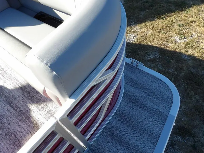 Slide: The Image of 2025 Bennington 21 SLJ pontoon boat with gray seating and red accents. - 9