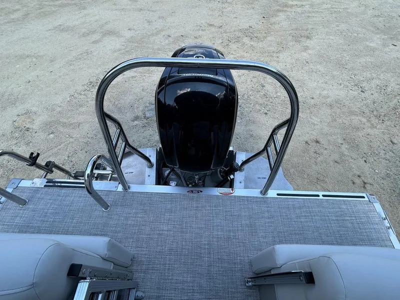 Slide: The Image of 2022 Harris Cruiser 230 boat with outboard motor and rear deck view. - 10