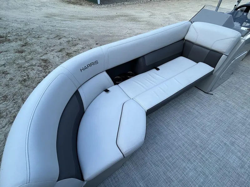 Slide: The Image of 2022 Harris Cruiser 230 boat interior with gray seating and modern design. - 9