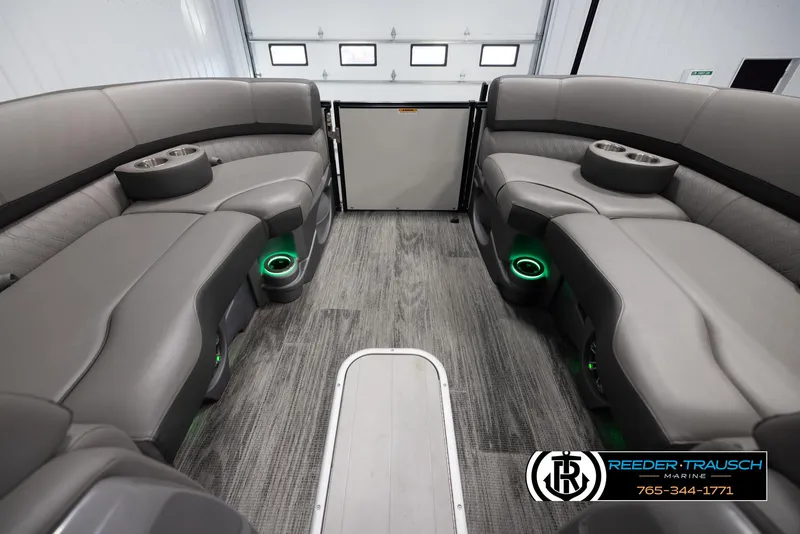 Slide: The Image of 2022 Avalon Waketoon interior with gray seating, green LED cup holders, and modern design. - 11