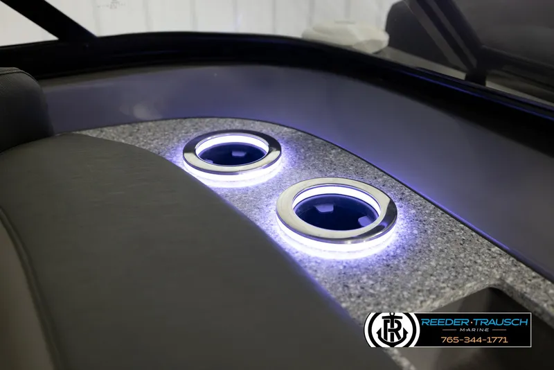 Slide: The Image of LED cup holders in 2022 Avalon Waketoon boat interior, featuring sleek design and ambient lighting. - 13