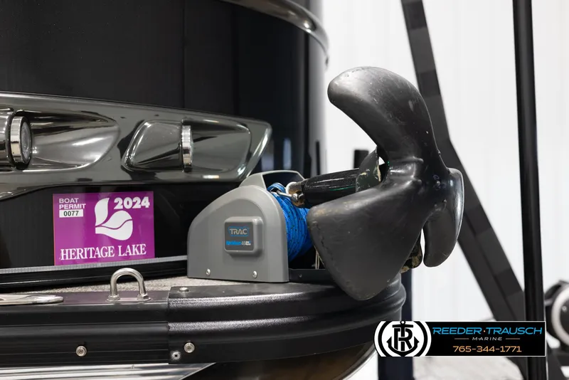 Slide: The Image of 2022 Avalon Waketoon boat with propeller and Heritage Lake permit sticker. - 19