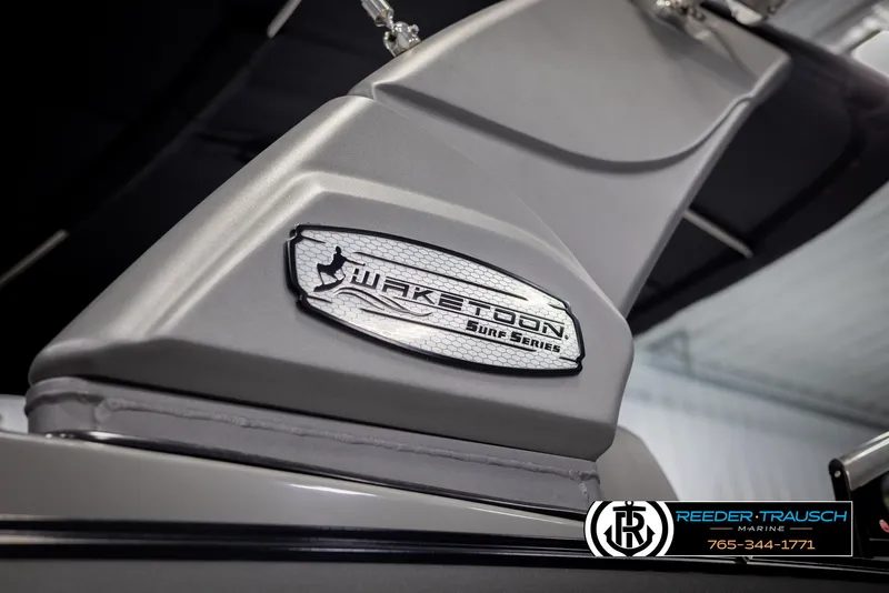 Slide: The Image of 2022 Avalon Waketoon Surf Series boat detail with logo, showcased indoors. - 20