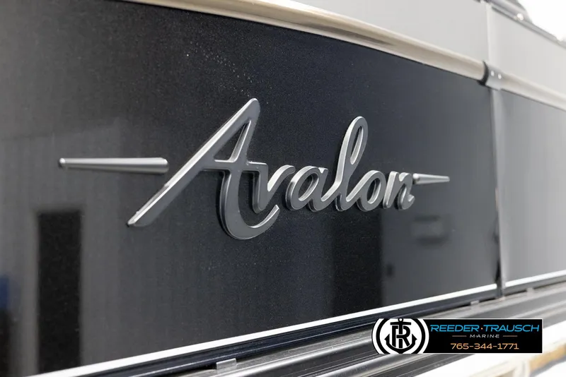Slide: The Image of 2022 Avalon Waketoon logo on sleek black surface, Reeder-Trausch Marine branding visible. - 21