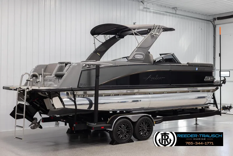 Slide: The Image of 2022 Avalon Waketoon boat on trailer in indoor showroom. - 3
