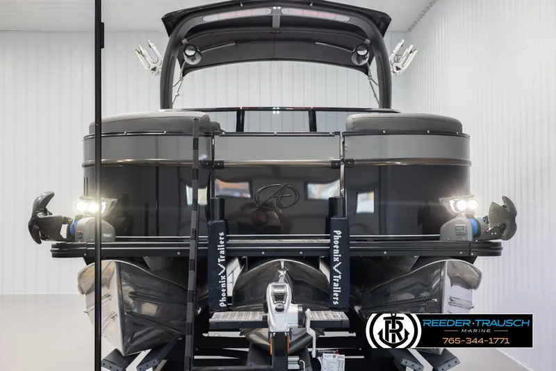 Slide: The Image of 2022 Avalon Waketoon boat in storage, featuring sleek design and modern lighting. - 5