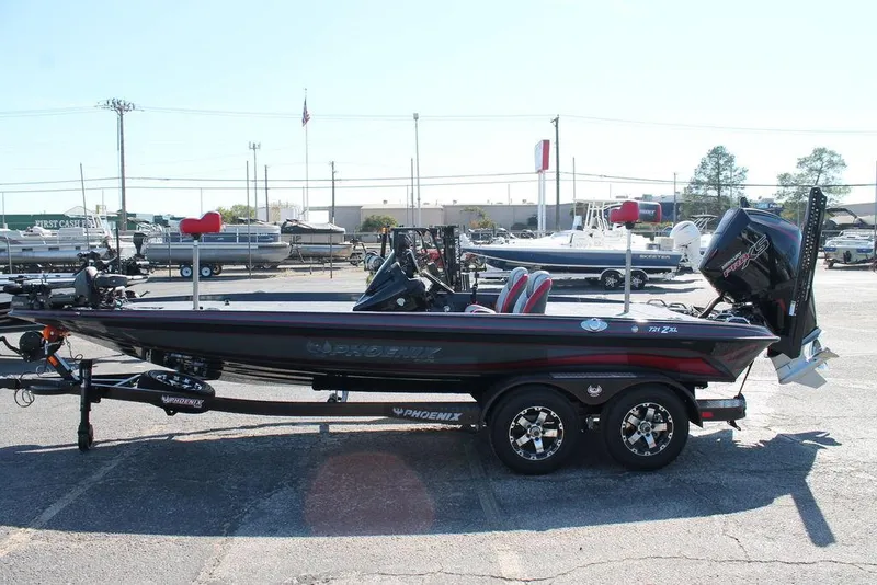 Slide: The Image of 2025 Phoenix 721 ZXL bass boat on trailer in parking lot, side view. - 4