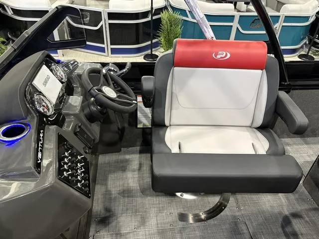 Slide: The Image of 2025 Princecraft Ventura 230 boat interior with steering wheel and cushioned seat. - 12