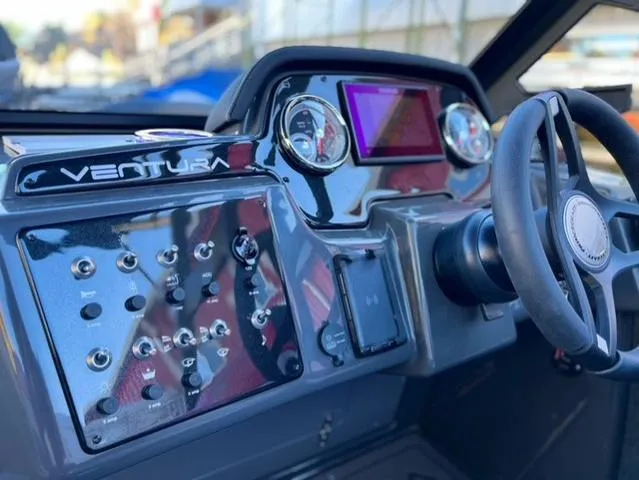 Slide: The Image of 2025 Princecraft Ventura 230 boat dashboard with controls and steering wheel. - 7